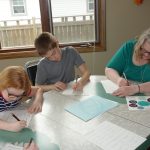 Family creating a family time capsule